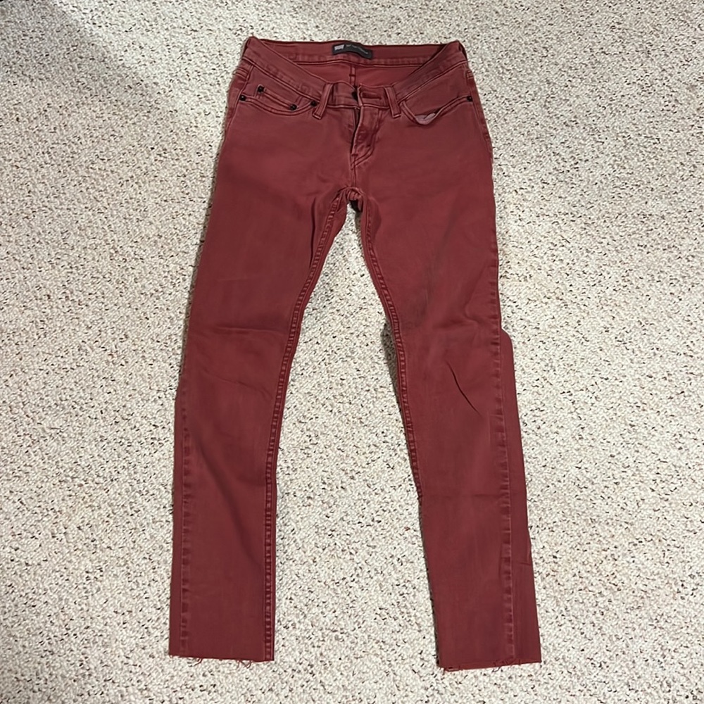 Size 3 medium Levi’s red jeans. Bottoms are cut to give that fringe look.